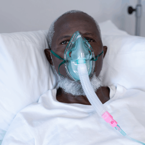 african-american-male-patient-lying-hospital-bed-wearing-oxygen-mask-ventilator
