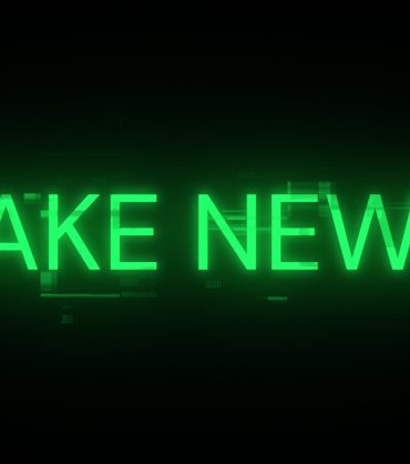 Fake news text with screen effects of technological failures. Spectacular screen glitch with various kinds of interference